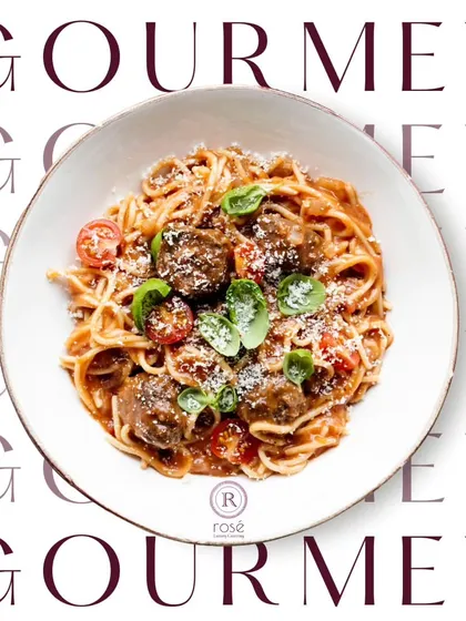 Gourmet is not just a word; it's our standard. This image of spaghetti and meatballs highlights our ability to execute classic international dishes with gourmet flair.