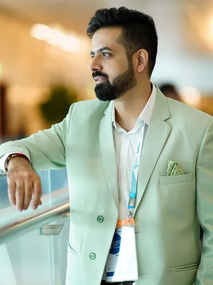 A candid, thoughtful shot taken between sessions at the Global Fintech Fest.