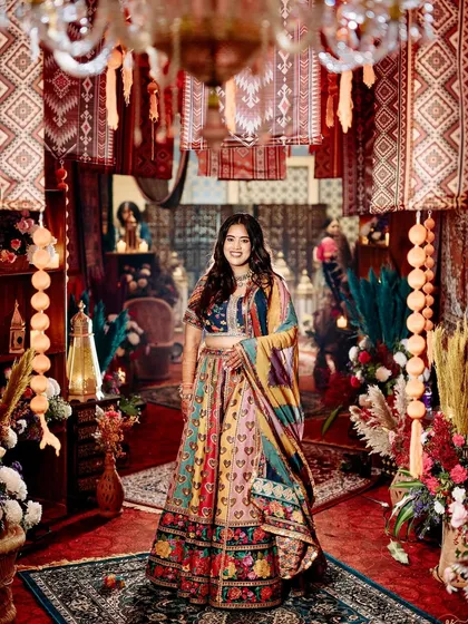 A full-length portrait of the bride, showcasing how her outfit and the decor come together to create a stunning, cohesive visual story.