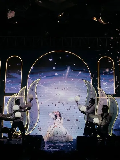 A dreamy bride's solo. We used a snow machine and celestial-themed props and background visuals to create a magical 'dancing under the stars' atmosphere.