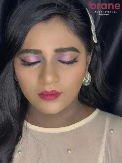 This direct shot shows how the lavender tones make the eyes pop, complemented by a matching pink lip.