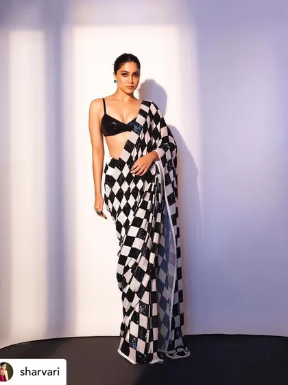 Another full-length view of the stunning Manish Malhotra saree look. The makeup was designed to be bold enough to stand out while maintaining an air of sophistication.