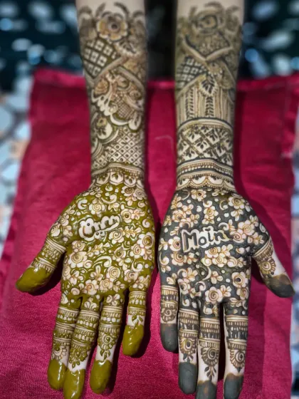 A quick yet elegant bridal design featuring the couple's names, 'Moin' and 'Oreen', surrounded by a delicate floral pattern on the palms.