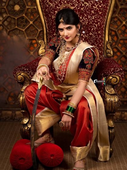 Another perspective from the Sreeleela warrior shoot, capturing the full regal attire and the ornate details of the throne room setting.