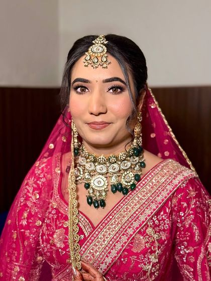 A final portrait of bride Vidhi. Her smile and the sparkle in her eyes are the best testament to a successful bridal look.
