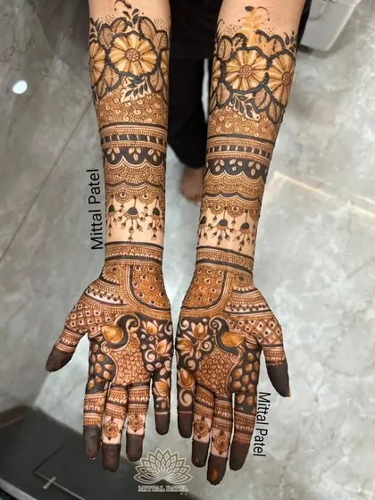 A beautiful example of a full-hand floral design, perfect for an engagement party or for a bridesmaid. The combination of bold flowers on the forearm and delicate peacock motifs on the palm creates a balanced and stunning look.