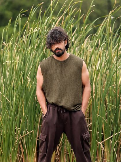 A series of portraits of actor Pruthvi Ambaar on location. These shots showcase a rugged, casual look against natural and industrial backdrops, highlighting his versatility.