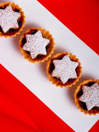 Our Sweet Mince Pies are bite-sized holiday treats, filled with rum-soaked fruits and spices and topped with a festive star.