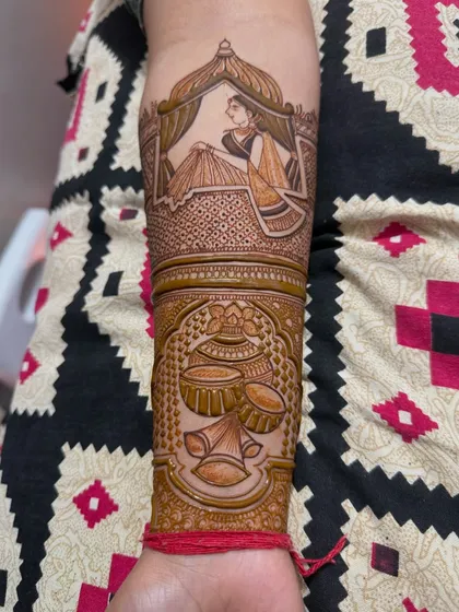 The bride-in-jharokha armband, with an additional band of traditional pots (kalash) below it, adding more symbolic elements to the design.