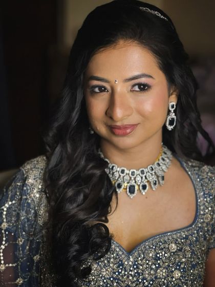 A close-up of this bride's reception makeup, with soft pink shimmery eyes and a natural lip.