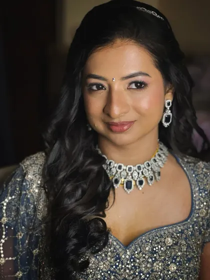 A close-up of this bride's reception makeup, with soft pink shimmery eyes and a natural lip.