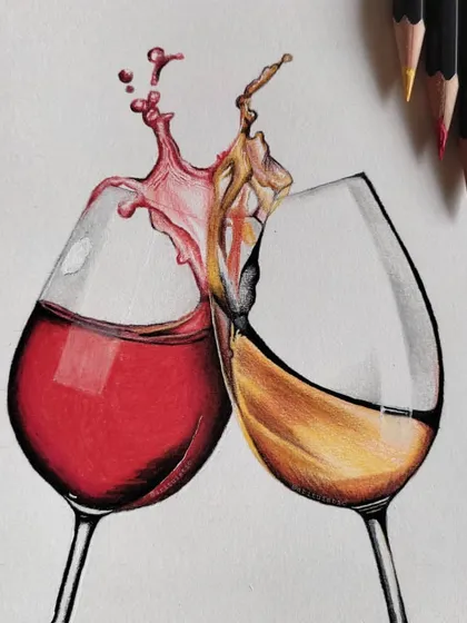 A finished colored pencil drawing of two clinking wine glasses, one with red wine and one with white. I focused on capturing the transparency of the glass and the dynamic splash.