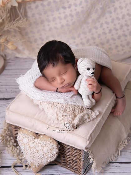 This little boy is holding his teddy bear tight. Capturing these small gestures and connections, even with a toy, makes for a truly heartwarming photo.