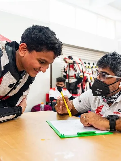 One on one feedback is crucial for development. Here, I am reviewing track data and performance with a young rider, helping him understand where he can improve and build on his natural talent.