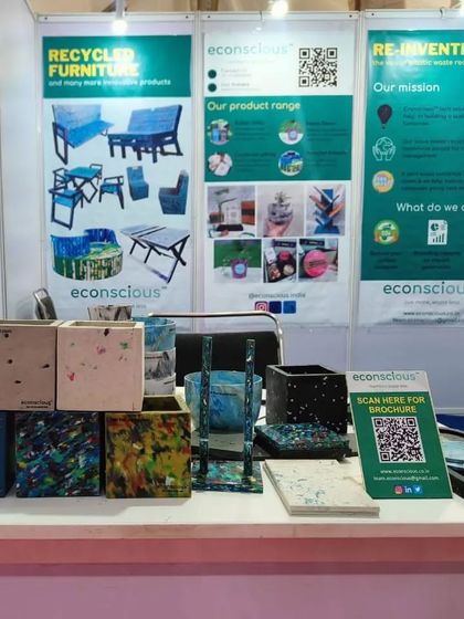 Our stall at the UP Global Investors Summit 2023. We displayed a range of our products, from small planters to our larger recycled furniture pieces.