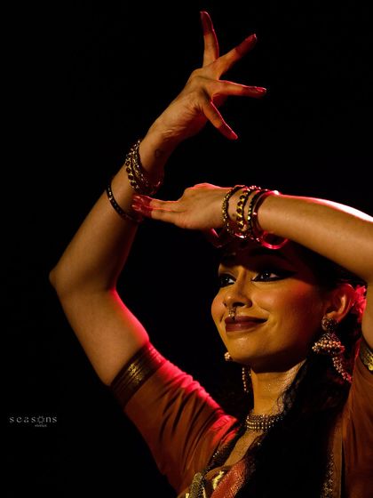 The intricate hand gestures, or mudras, are the language of Bharatanatyam. Here, I'm using them to tell the story of the goddess Durga, conveying both her power and her grace.