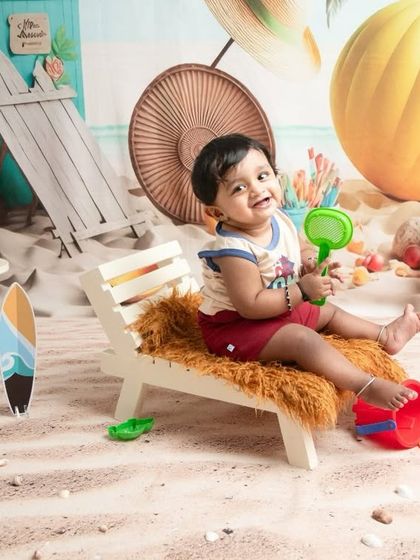 After splashing in the tub, this little one is enjoying some time on the "sand." The beach theme allows for a variety of shots, both in and out of the water, to capture your toddler's playful spirit.