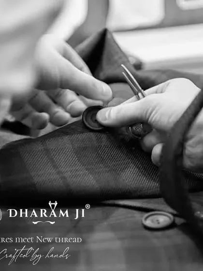 Every detail is crafted by hand. Here, a button is being carefully stitched onto a jacket, a small but essential step that ensures the quality and longevity of your bespoke piece.