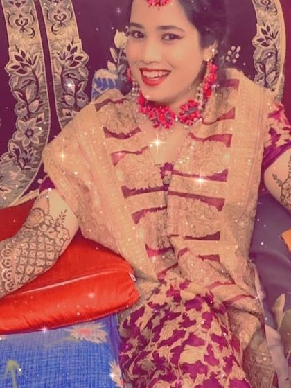 Another shot of this happy bride, glowing with joy. The sparkle filter adds a festive touch, highlighting her beautiful smile and henna.