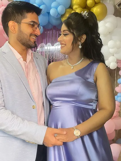A sweet moment between the parents-to-be. The makeup is designed to be picture-perfect for capturing these precious memories.