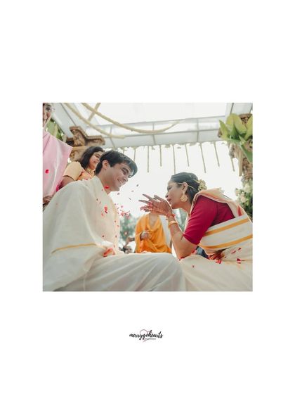 A candid, playful moment between the bride and groom during their ceremony. We believe weddings should be as fun as they are sacred.