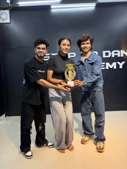 Celebrating a female student's victory. We are proud to train and empower strong female dancers.