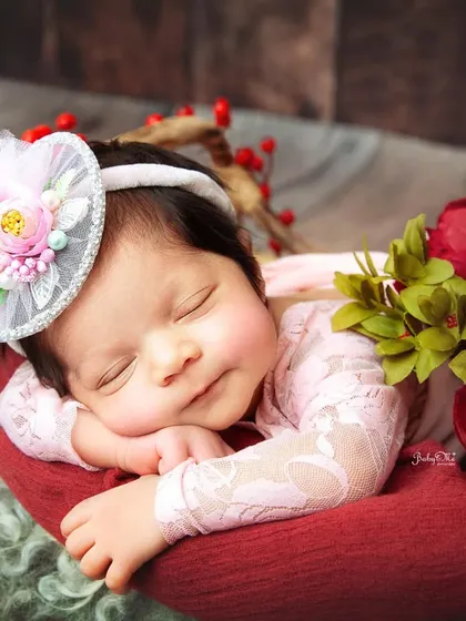 A beautiful smile from this sleeping baby girl, dressed in soft pink lace. These are the moments that make my heart melt every single time.