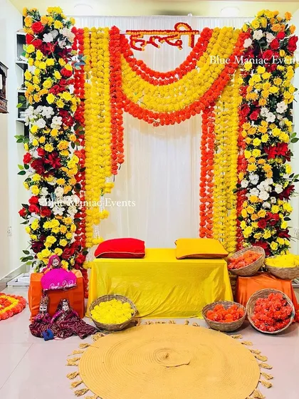 A wider view of the corridor Haldi setup, showing how all the elements come together to create a festive atmosphere in a compact space.