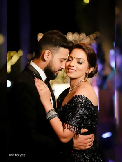 A beautiful, tender moment between the couple. Her eyes are closed as she leans into his embrace, a perfect picture of love and trust on their reception night.