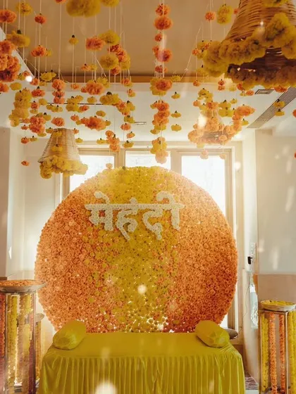 You can never go wrong with a classic. This vibrant mehendi backdrop is made entirely of fresh genda phool (marigolds), creating a sun-kissed, traditional setting that is both timeless and joyful.