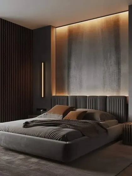 For a bold and dramatic look, we designed this bedroom with dark, textured walls and integrated backlighting. The low-profile grey bed and minimalist side tables create a moody and sophisticated vibe.