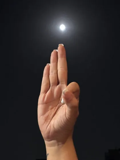 A hand gesture, or mudra, directed towards the full moon. Each part of our ceremony, from affirmations to moon gazing, is a step on a soulful journey to connect with our inner and outer worlds.