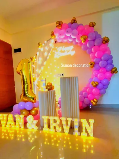 A full view of the twins' birthday decor, showing the complete setup in a room.