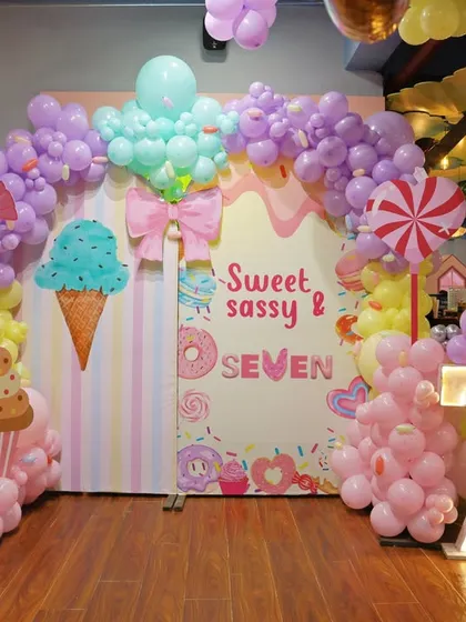 We can transform our space to match any theme, like this sweet and sassy Candyland adventure. Our decor packages include custom backdrops, themed balloon sculptures, and large marquee numbers to make the setting truly special.
