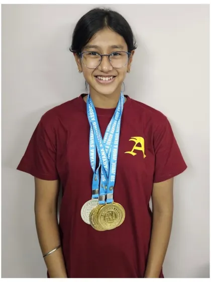 A display of versatility and excellence. Prapti Ghose with her medals after qualifying for the Open Nationals in all four swimming strokes, a historic achievement for any swimmer from Haryana.