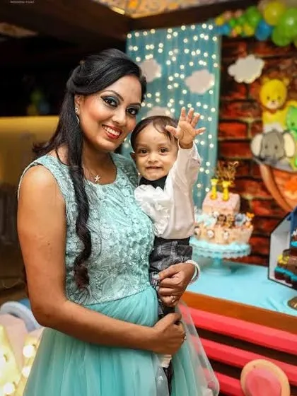 A mother and her happy, waving baby boy. These cheerful and interactive shots are a wonderful part of any event gallery.