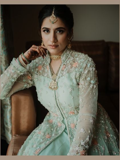 A stunning portrait of the bride, her elegance and beauty shining through. We focus on creating timeless images that capture the bride's essence.