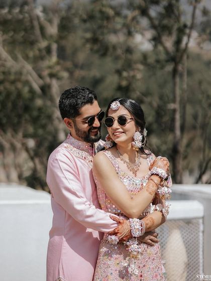 A cool and stylish portrait of Rohit and Mehak in sunglasses during their Haldi ceremony, showing a modern twist on tradition.