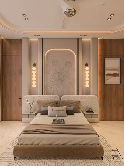 This master bedroom is a study in serene luxury, featuring a custom-designed headboard with intricate relief work and layered ambient lighting. The use of warm wood and soft, neutral tones creates a tranquil retreat designed for rest and relaxation.