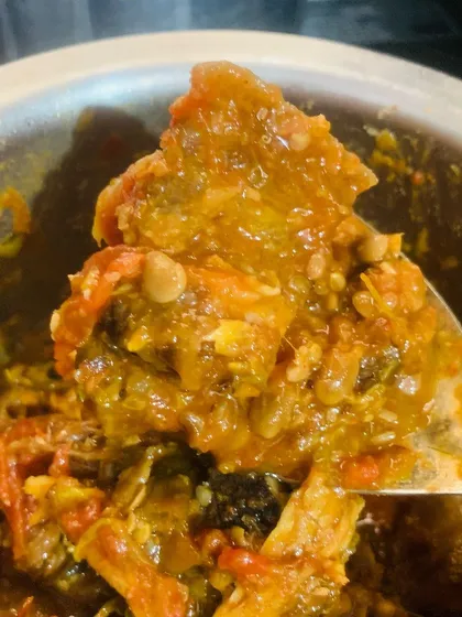 The rich, mashed texture of the smoked pork with Axone after it has been slow cooked.