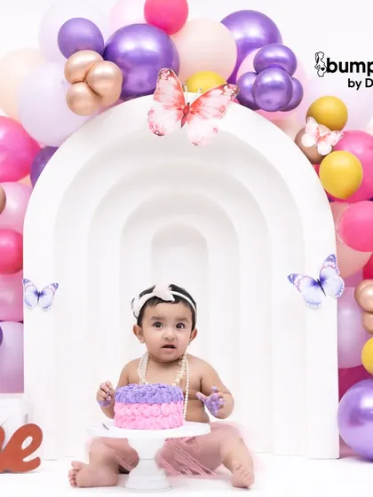 A butterfly garden of balloons for this little one's first birthday cake smash. The purple and pink color palette is so sweet and whimsical.