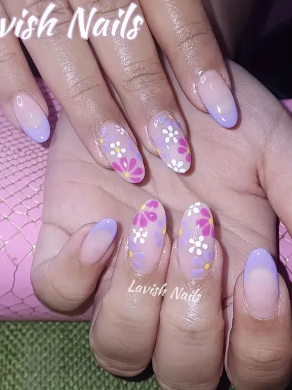 A delicate floral design with small, hand-painted daisies in pink, white, and purple on a sheer lilac base.