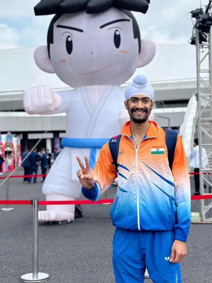 A memorable moment from the Asian Championship in China, posing with the event mascot. These experiences are part of the incredible journey that sports can offer.