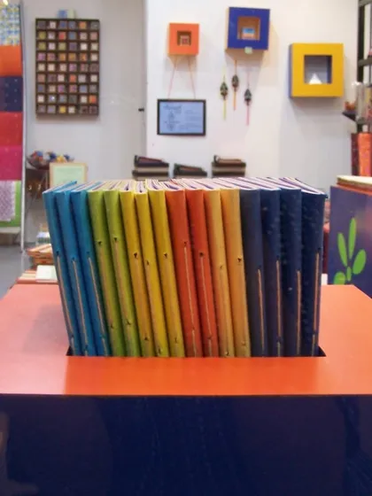 This was our first store in the DLF Centre Mall in Gurgaon. We painted old trunks, built our own pinboards, and filled the space with things we loved, like these colorful handmade journals.