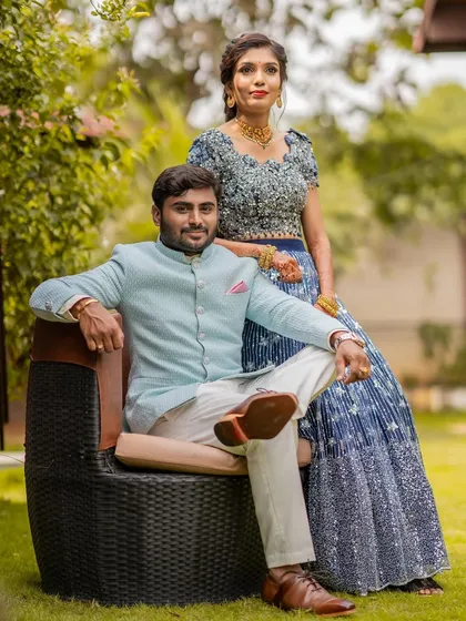 The lovely couple at their ring ceremony. Her makeup is elegant and polished, complementing his attire perfectly for their official portraits.