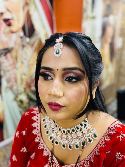 A close-up of a Karwa Chauth makeup look. This features a dramatic smokey eye and a deep berry lip, perfect for the festive occasion.