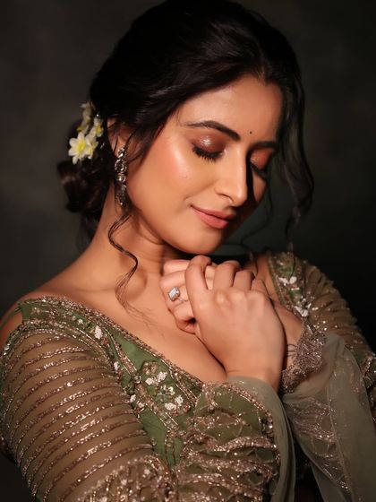 A close-up of the festive look, with the model's eyes closed to show off the beautiful eyeshadow.