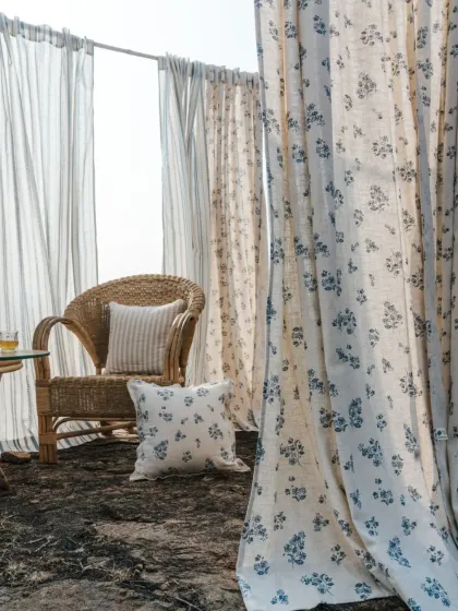 I believe your home should be a sanctuary. This outdoor setting from our 'Pause' collection, with its light-filtering sheers and floral cottons, captures the essence of the calm and natural beauty I strive to bring into every space.