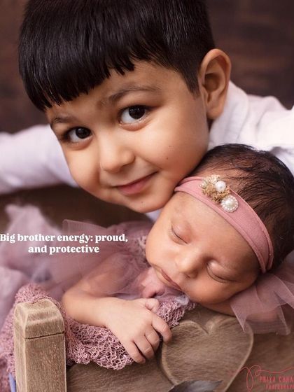 Big brother energy: proud, protective, and so full of love for his new baby sister. This pose is a simple and sweet way to capture the sibling connection.