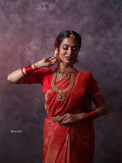 Using dramatic side lighting in the studio to create shadows and depth. This technique adds a moody and artistic feel to this traditional portrait.